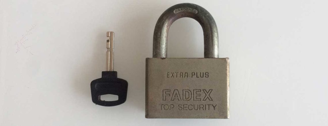 Image contains a photo of a small padlock with a key placed next to it.